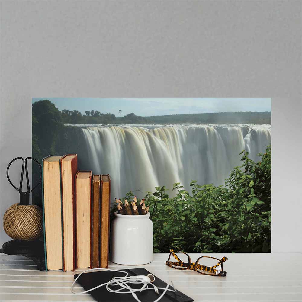 16x24 inch Victoria Falls Poster Displayed Behind Items on Shelf