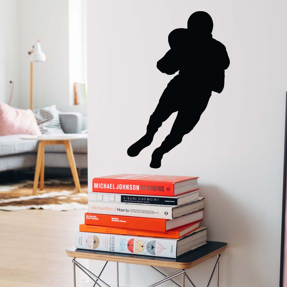 24 inch Football Carrier Silhouette Wall Decal Installed in Hallway