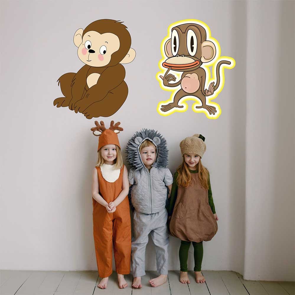 Children in animal-themed costumes standing against a white wall with 24 inch Pondering Monkey cartoon decal installed on wall.