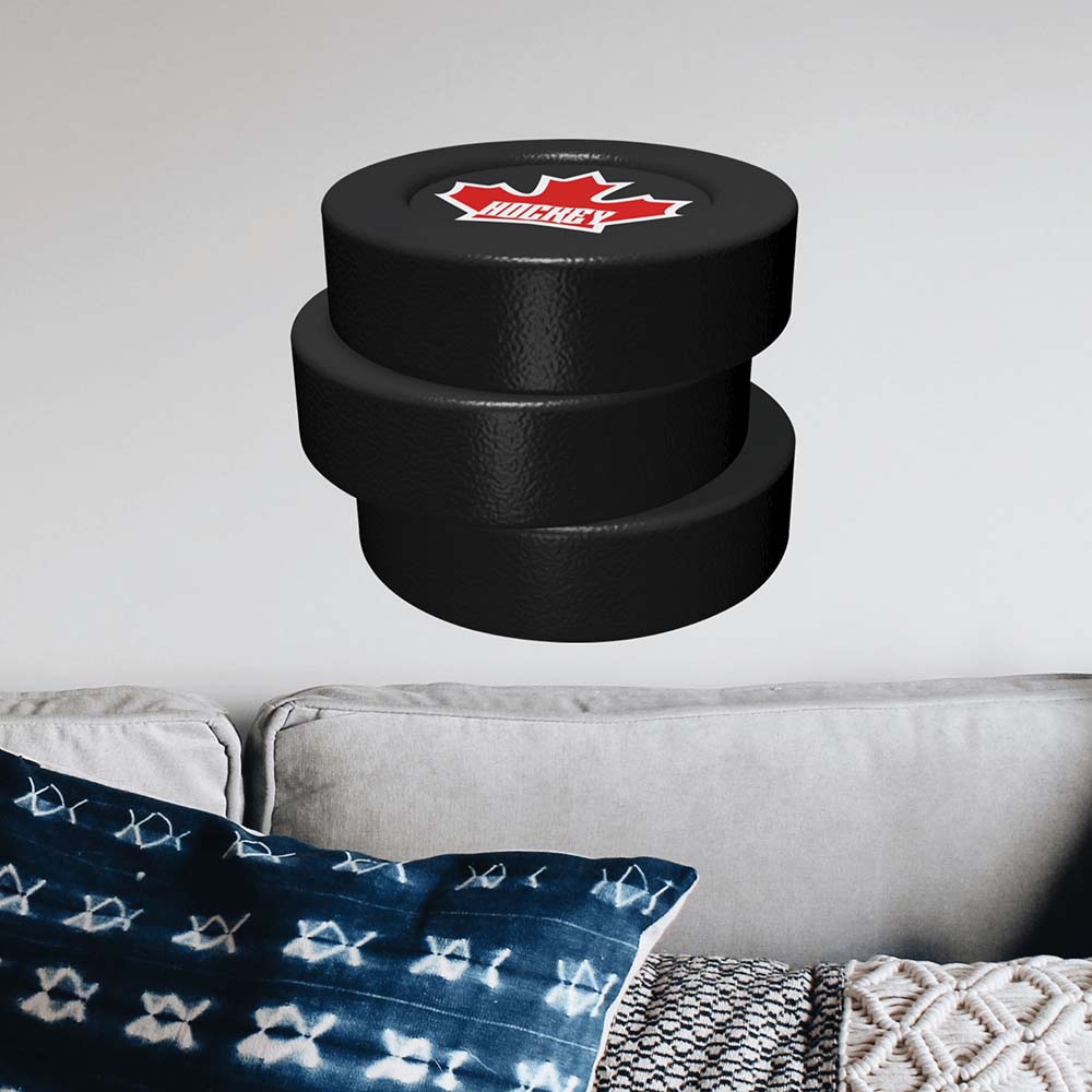 24x24 inch Hockey Puck Stack Decal Installed Above Sofa