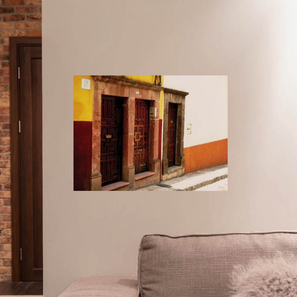 24 inch entrance doors on Mexican buildings decal installed on wall above above sofa