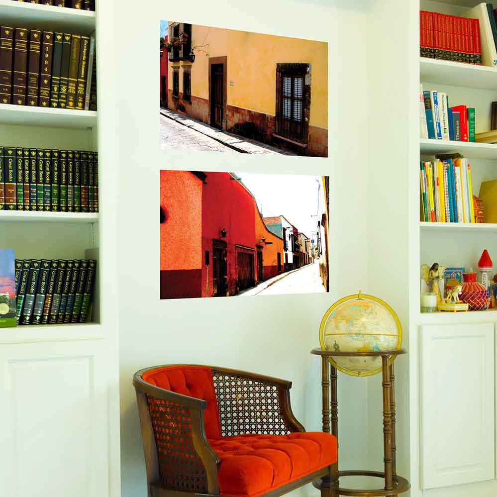 24 inch Mexican street and yellow home architecture decal installed on a wall above red chair and globe