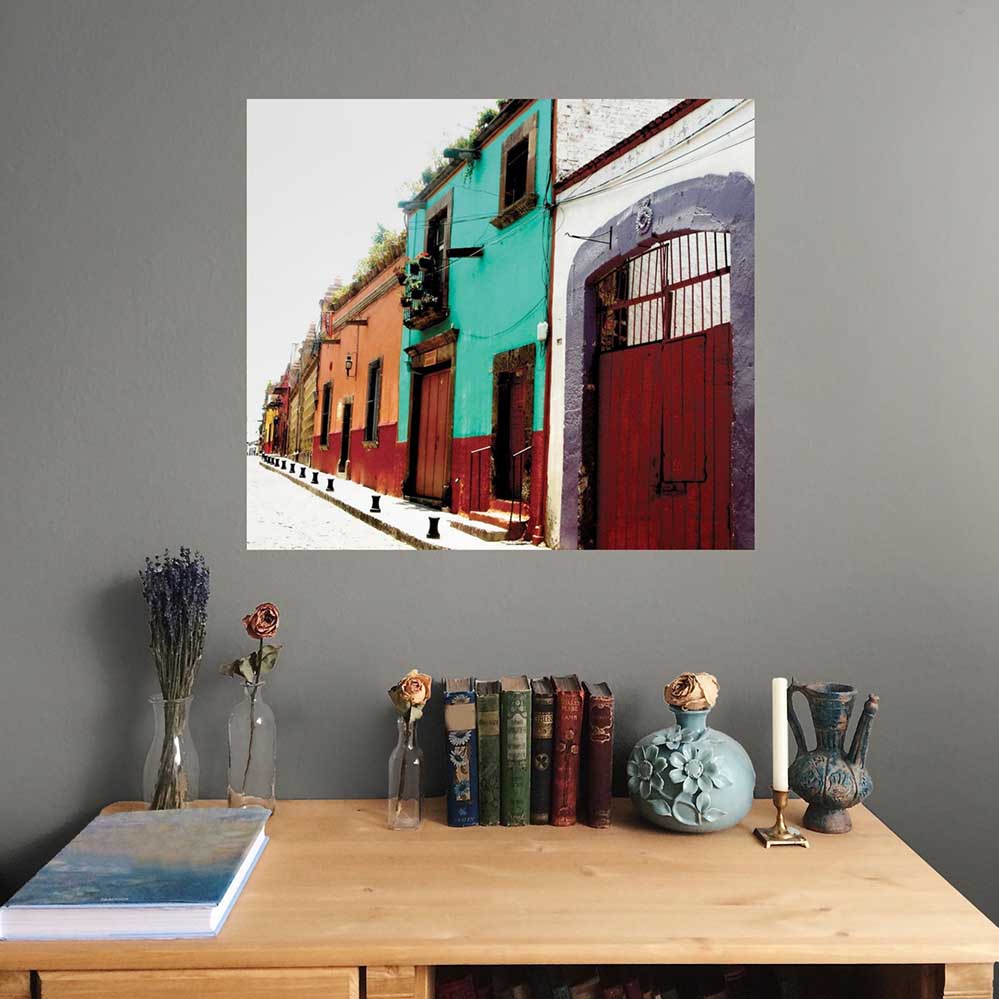 24 inch colorful Mexican street architecture wall decal installed on a gray wall above a wooden desk