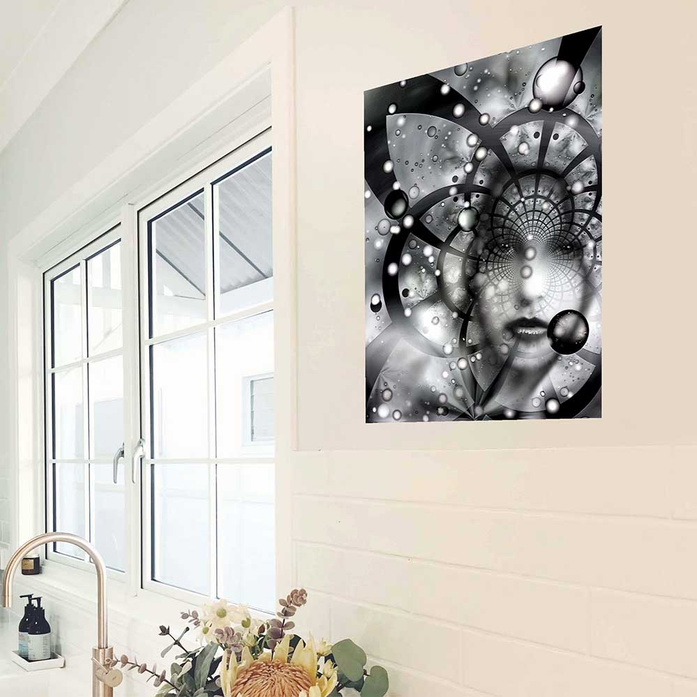 24 inch poster of an abstract black and white fractal artwork features the ghostly visage of a woman emerging from an abstract spiral of cosmic grids, celestial spheres, and radiant particles installed on wall in kitchen next to window