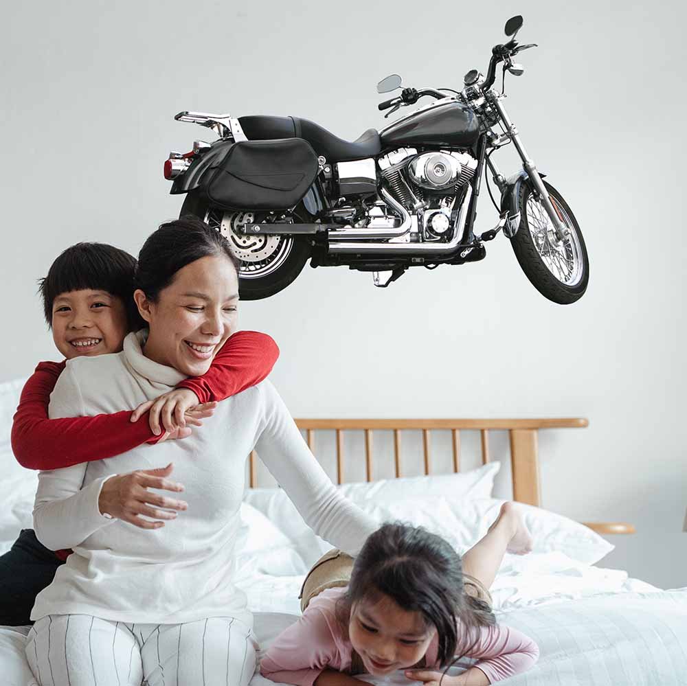 36 inch black and silver commuter motorcycle decal installed on wall above kids bed
