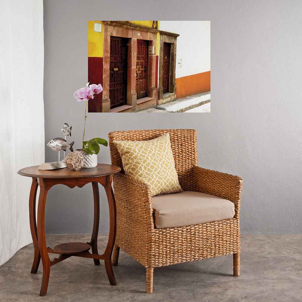 36 inch multi door entrance to Mexican buildings decal installed on wall above wicker table and chair