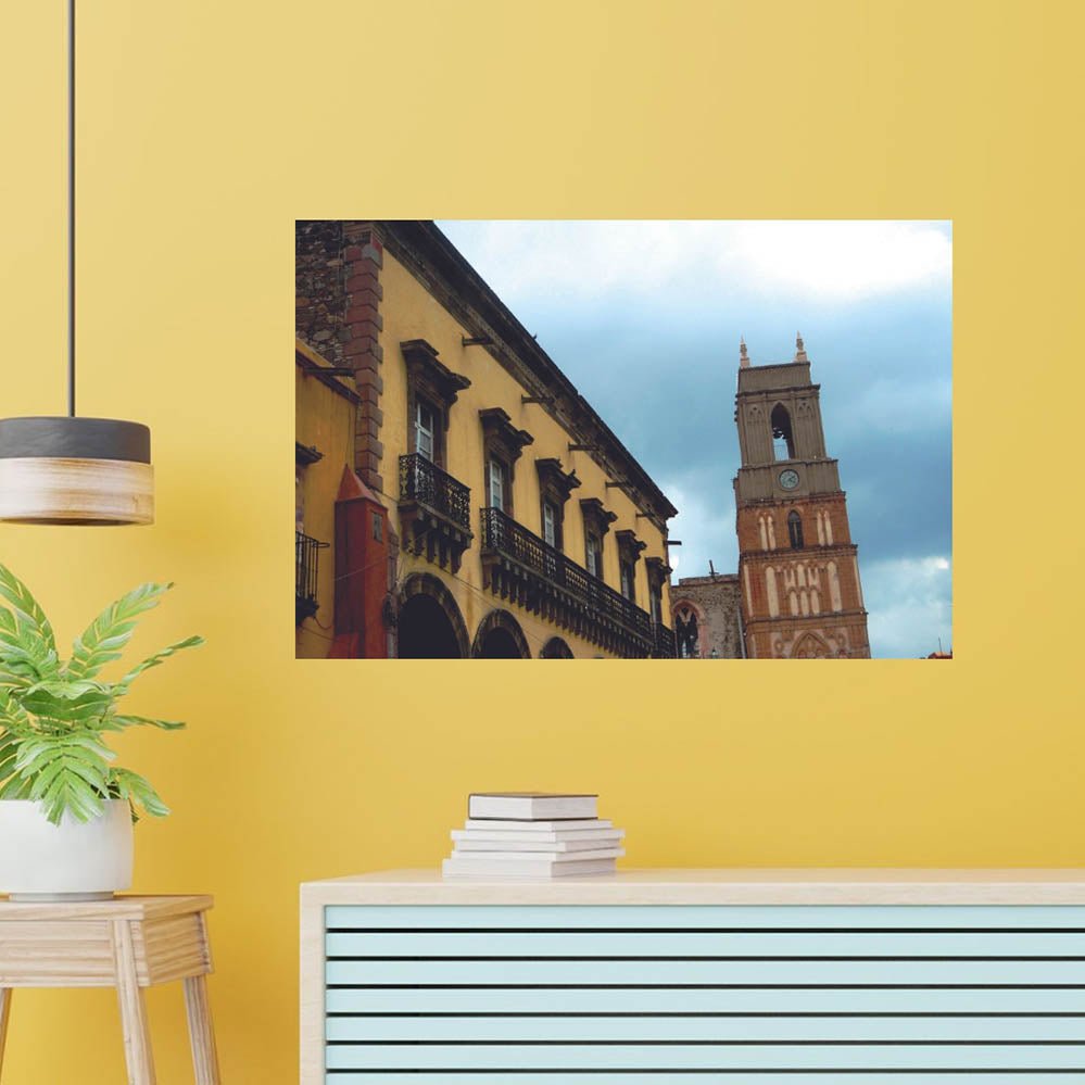 36 inch Mexican cathedral tower and building against a blue sky wall decal installed on wall above a counter