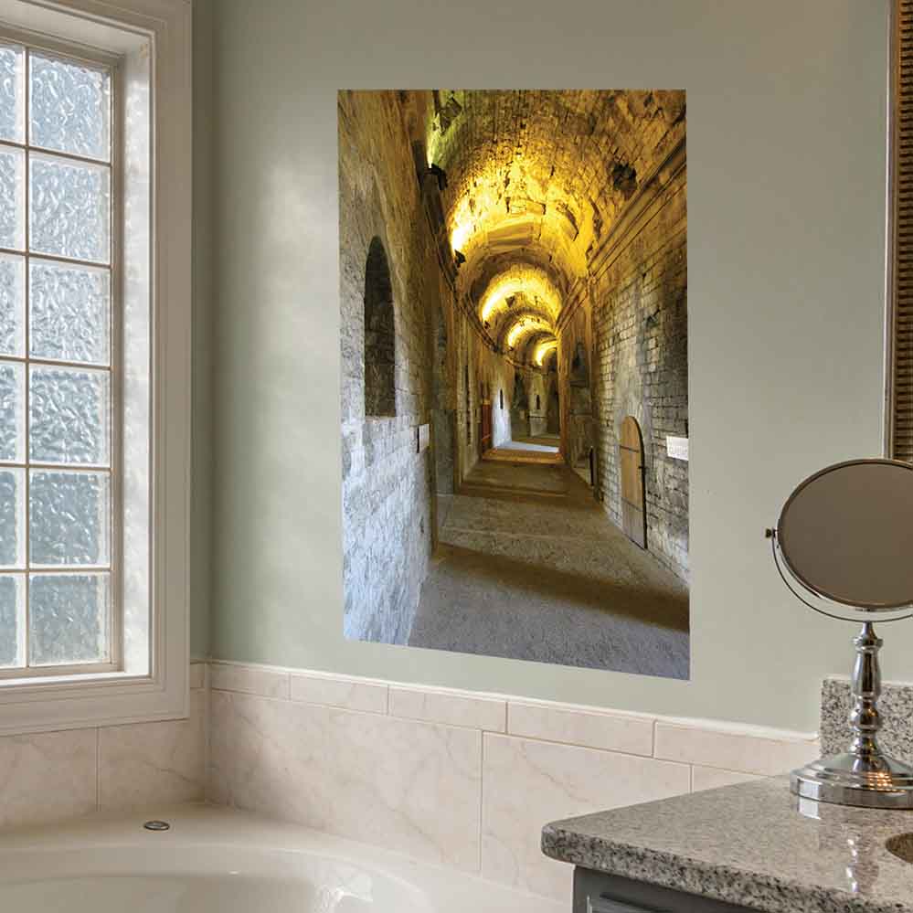 36 inch poster long, narrow corridor with arches of Roman arena in Nimes France installed on a wall in a bathroom