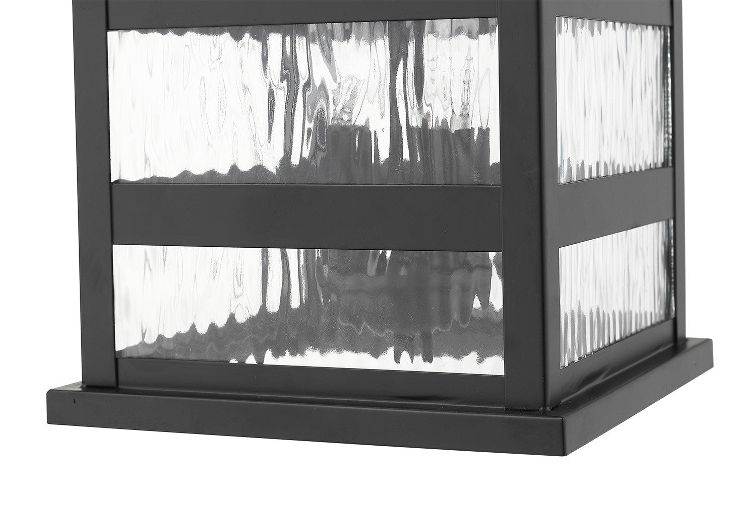 Zoomed in view of the bottom frame and glass of the Morris 3-Bulb Matte Black Outdoor Wall Light with Clear Water Glass