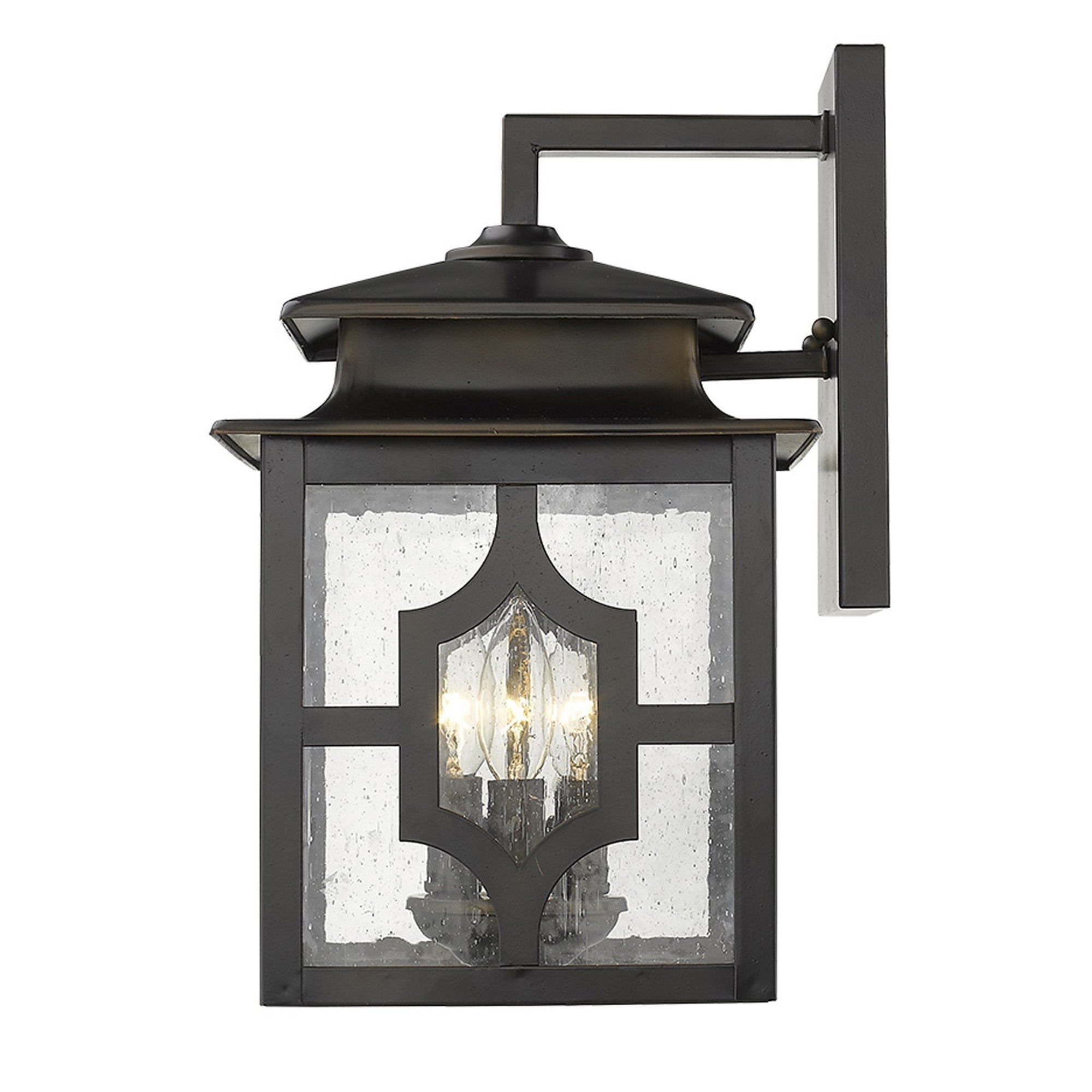 Side view of the lighted Calvert 3-Light Oil-Rubbed Bronze Wall Fixture with seeded glass for outdoor and indoor use