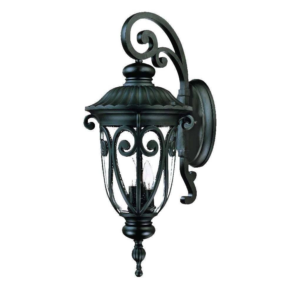 Front right angle view of the Naples 3-Bulb Matte Black Outdoor Hanging Wall Light with Seeded Glass and Italian Scroll Design