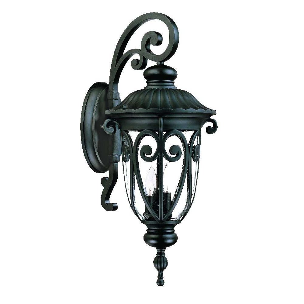 Front left angle view of the Naples 3-Bulb Matte Black Outdoor Hanging Wall Light with Seeded Glass and Italian Scroll Design