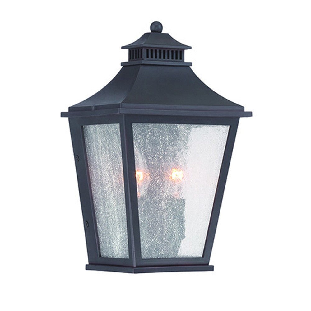 Front left angle view of the lighted Matte Black Two Light Outdoor Pocket Lantern Wall Light with Frosted Glass