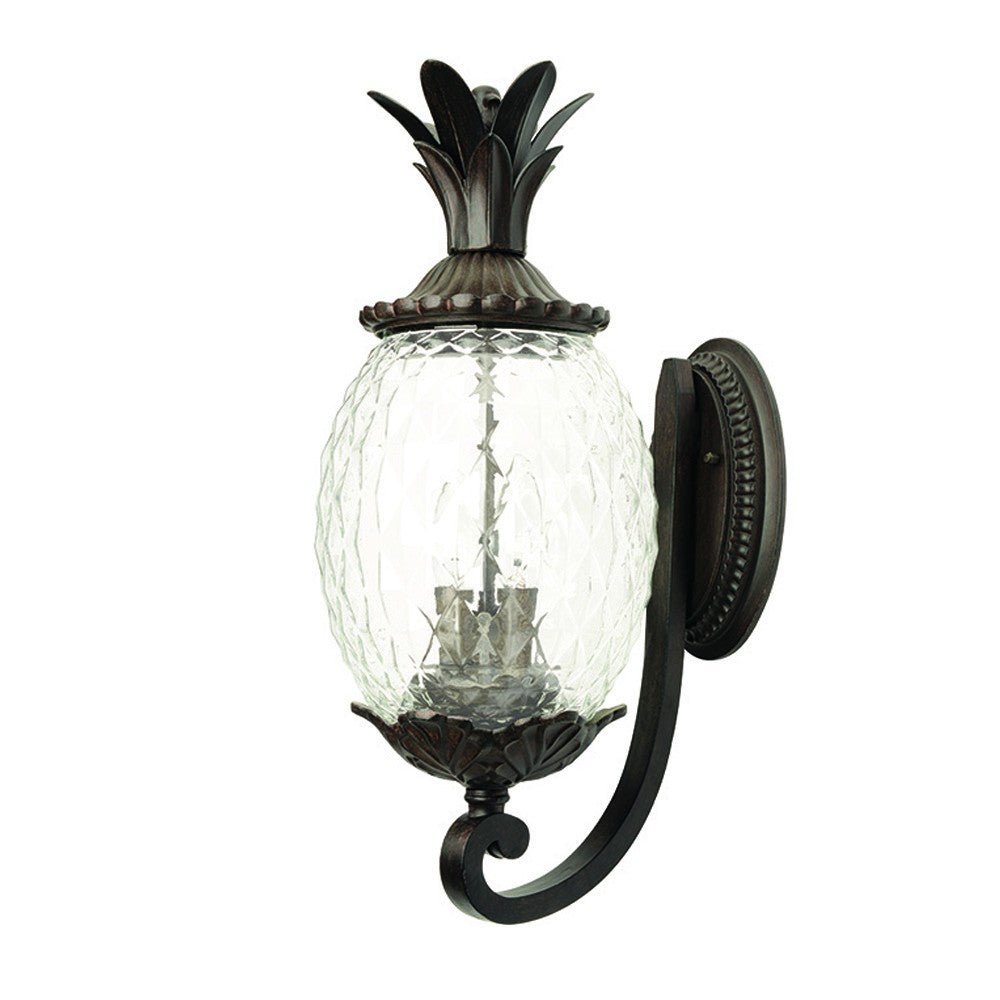 Front right angle view of the Lanai 3-Bulb Upward Outdoor Wall Light in Black Coral Finish with Pineapple Textured Glass