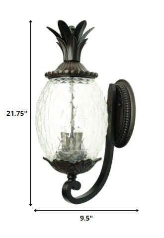 Lanai 3-Bulb Upward Outdoor Wall Light in Black Coral Finish with Pineapple Textured Glass shown with dimensions of 21 point 75 inches high by 9 point 5 inches wide