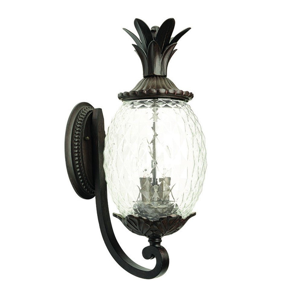 Front left angle view of the Lanai 3-Bulb Upward Outdoor Wall Light in Black Coral Finish with Pineapple Textured Glass