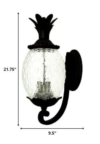 Lanai 3-Bulb Matte Black Upward Outdoor Wall Light with Pineapple Textured Glass shown with dimensions of 21 point 75 inches high by 9 point 5 inches wide
