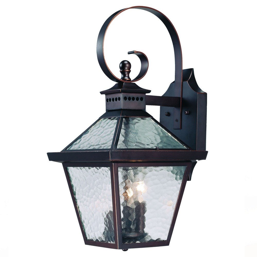 Front right angle view of the lighted Bay Street Triple-Light Architectural Bronze Outdoor Wall Lantern with Hammered Glass