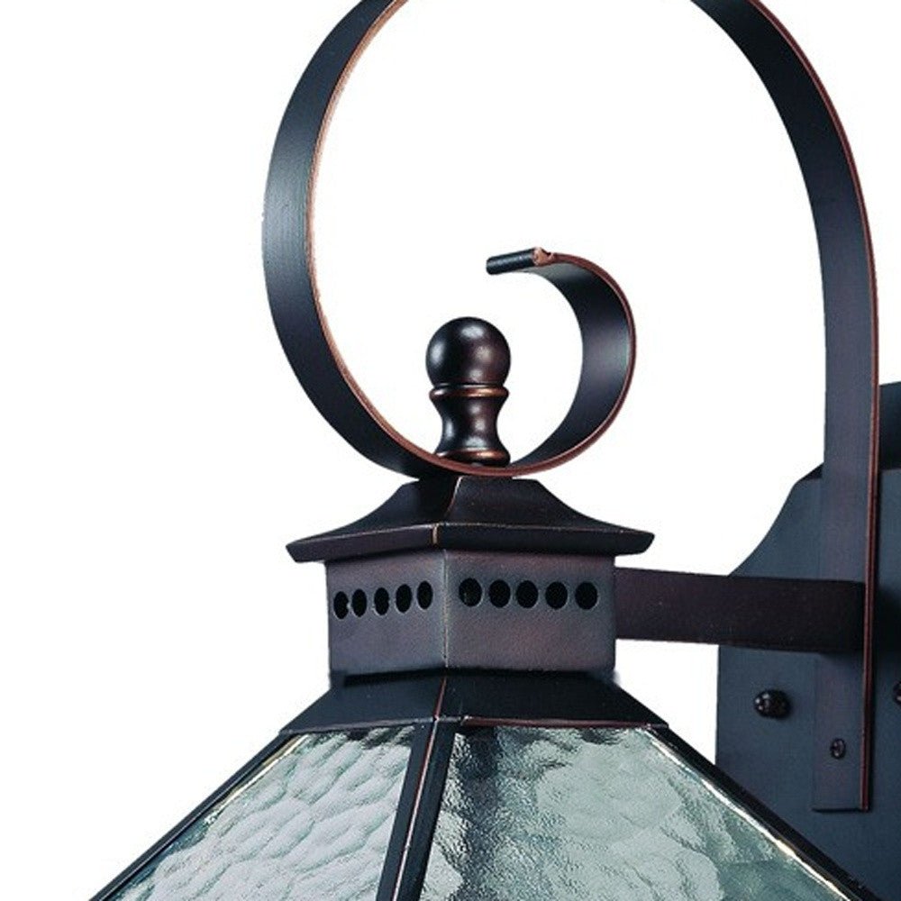 Close up view of the swirl arm and hammered glass of the  Bay Street Triple-Light Architectural Bronze Outdoor Wall Lantern with Hammered Glass