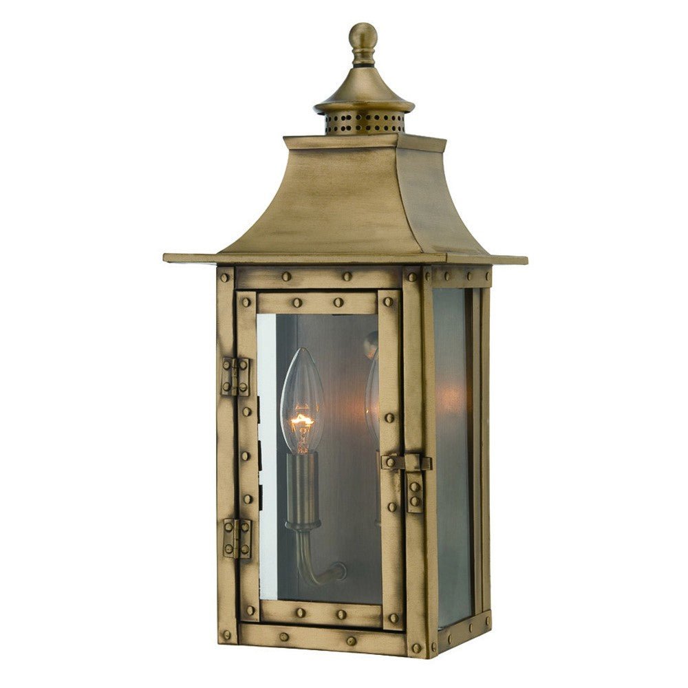 Front right angle view of the lighted St. Charles 2-Bulb Aged Brass Colonial Outdoor Wall Lantern Light