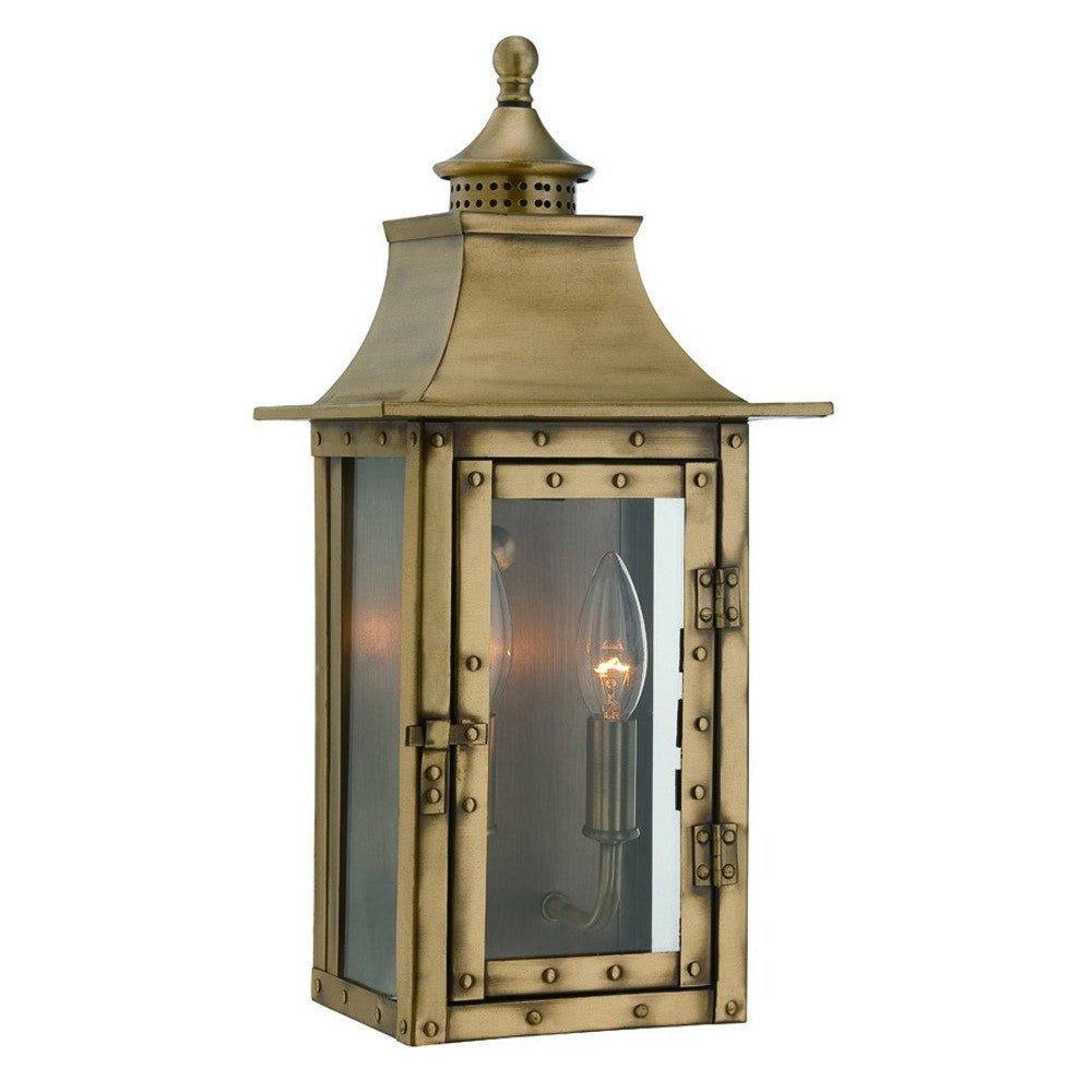Front left angle view of the lighted St. Charles 2-Bulb Aged Brass Colonial Outdoor Wall Lantern Light