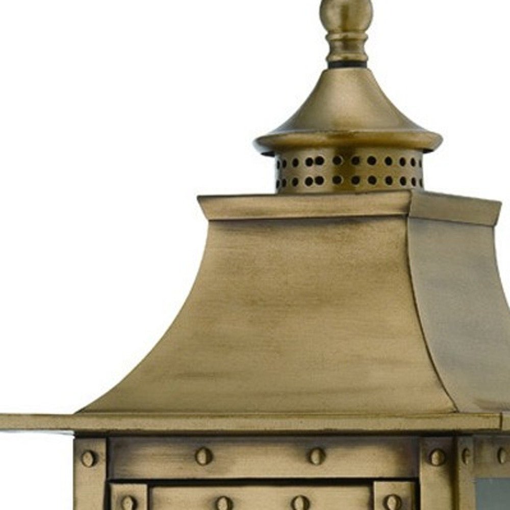 Close up view of the fixture top of the lighted St. Charles 2-Bulb Aged Brass Colonial Outdoor Wall Lantern Light