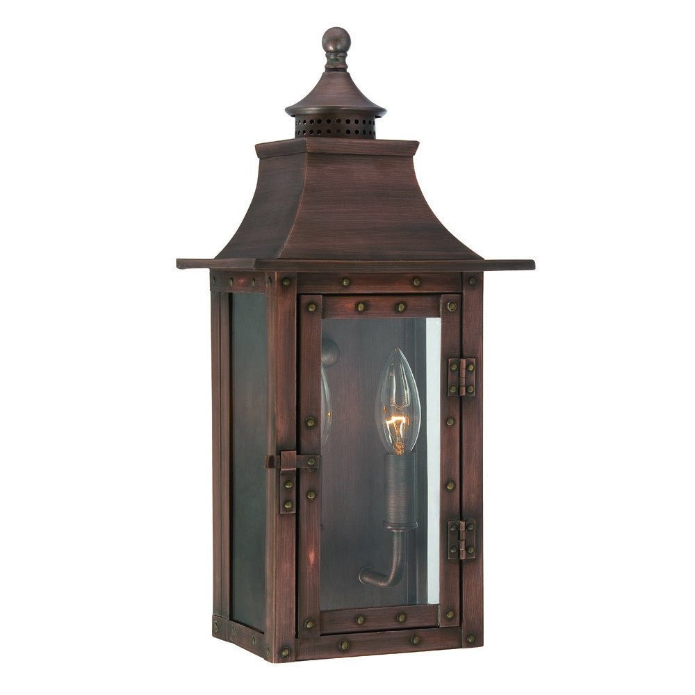 Front left angle view of the lighted St. Charles 2-Bulb Copper Patina Colonial Outdoor Wall Lantern Light