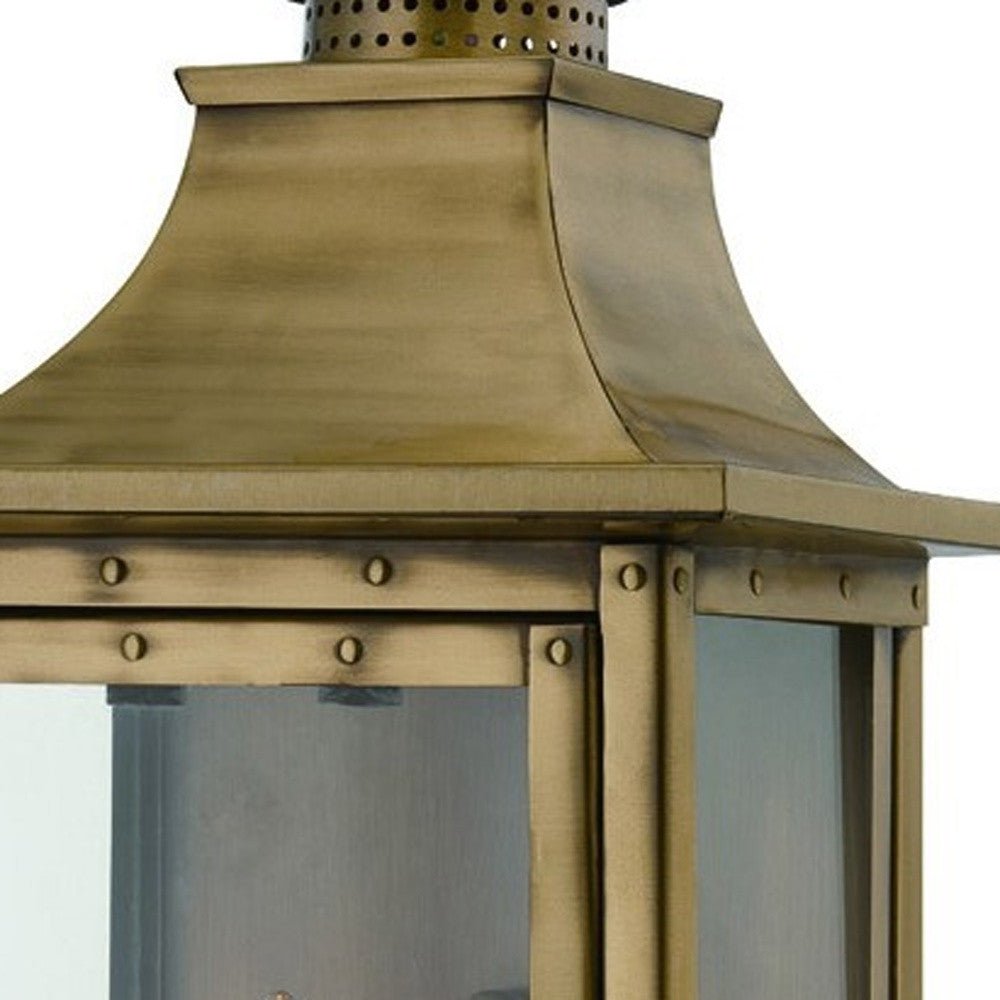 Zoomed in view of the fixture top with rivets of the lighted St. Charles 2-Bulb Aged Brass Colonial Outdoor Wall Lantern Light 10x20