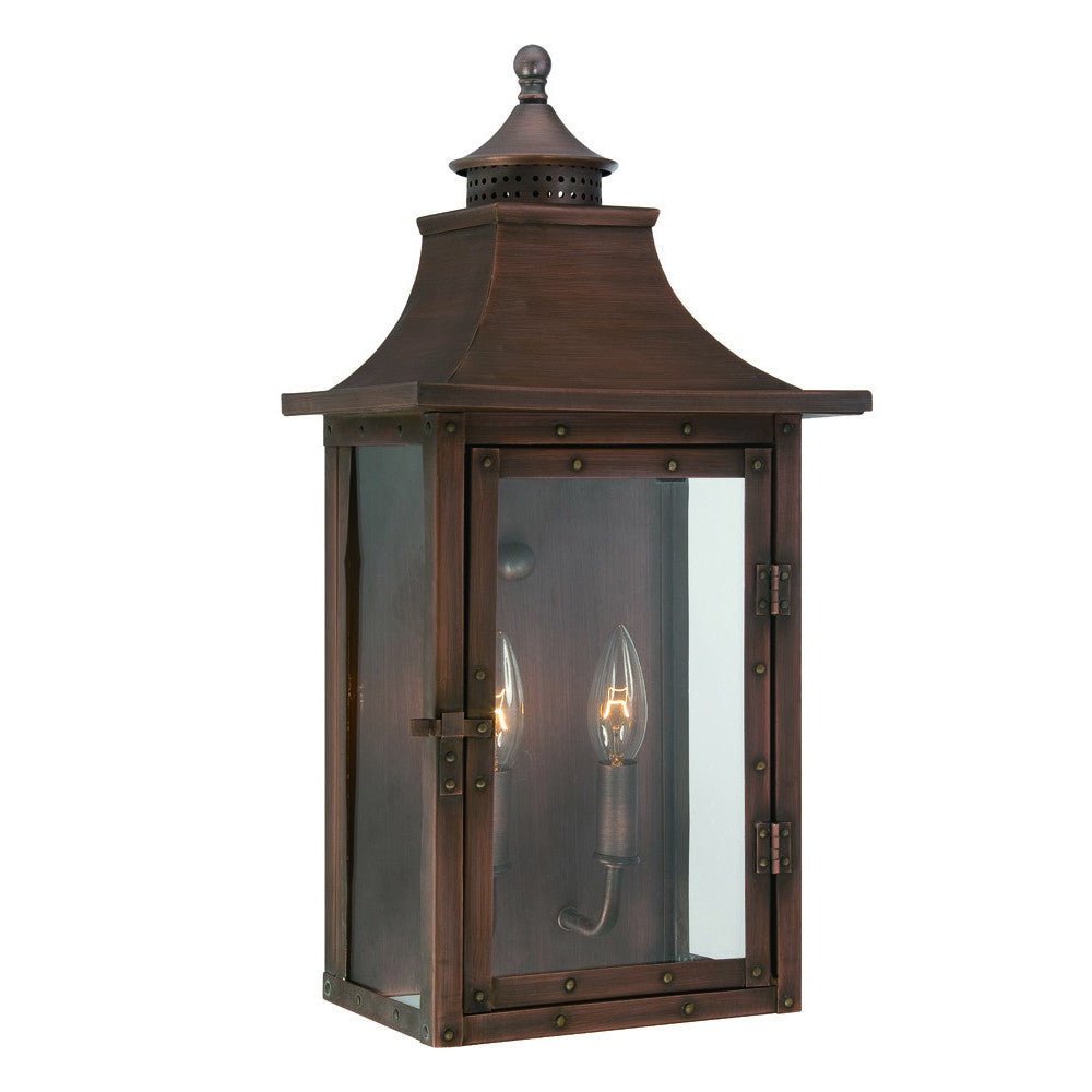 Front left angle view of the lighted St. Charles 2-Bulb Copper Patina Colonial Outdoor Wall Lantern Light 10x20