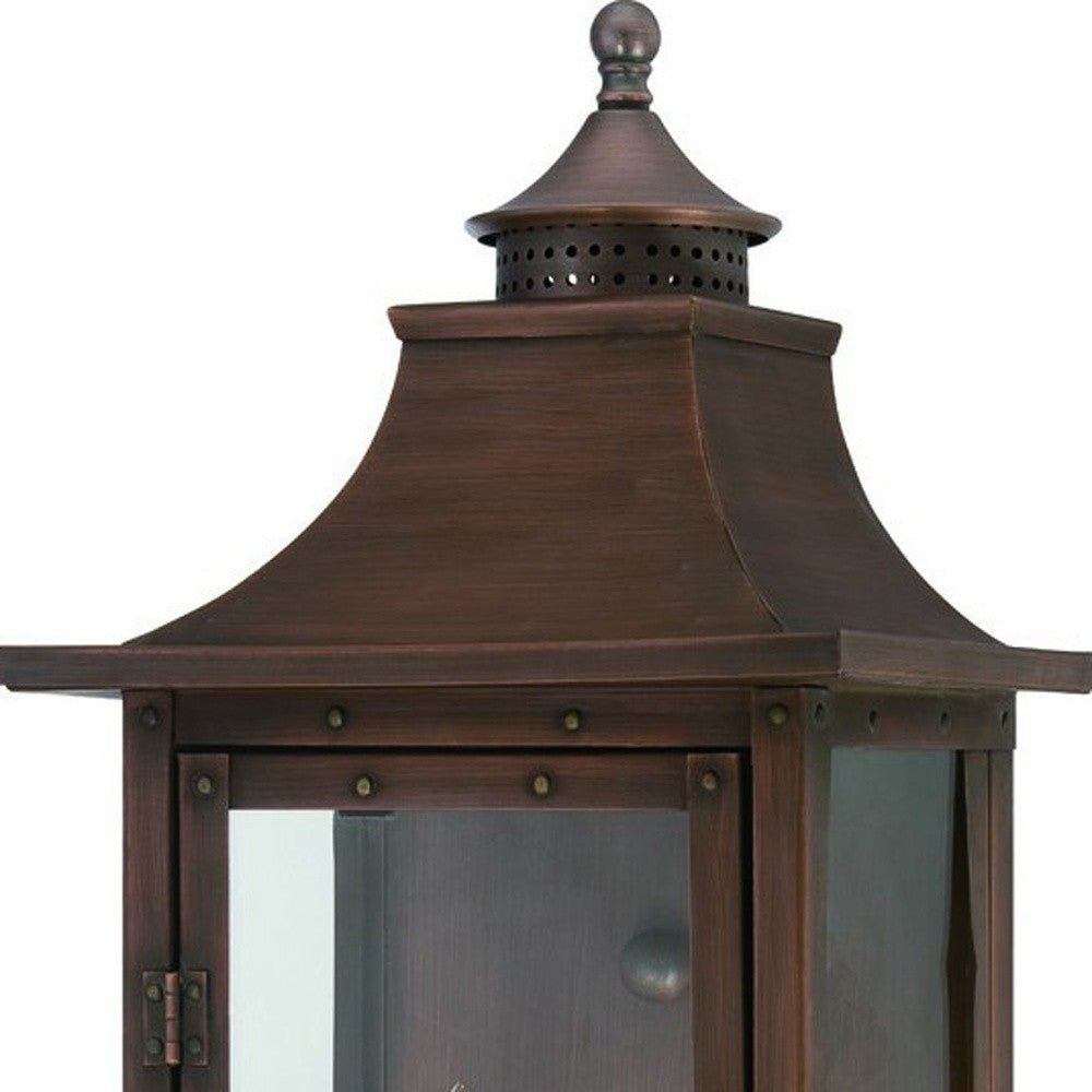 Zoomed in view of the lantern top of the lighted St. Charles 2-Bulb Copper Patina Colonial Outdoor Wall Lantern Light 10x20