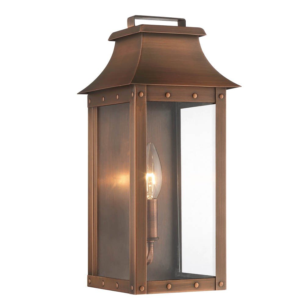 Front left angle view of the lighted Manchester 1-Bulb Copper Patina Pocket Wall Lantern – Rustic Outdoor Copper Lighting Fixture