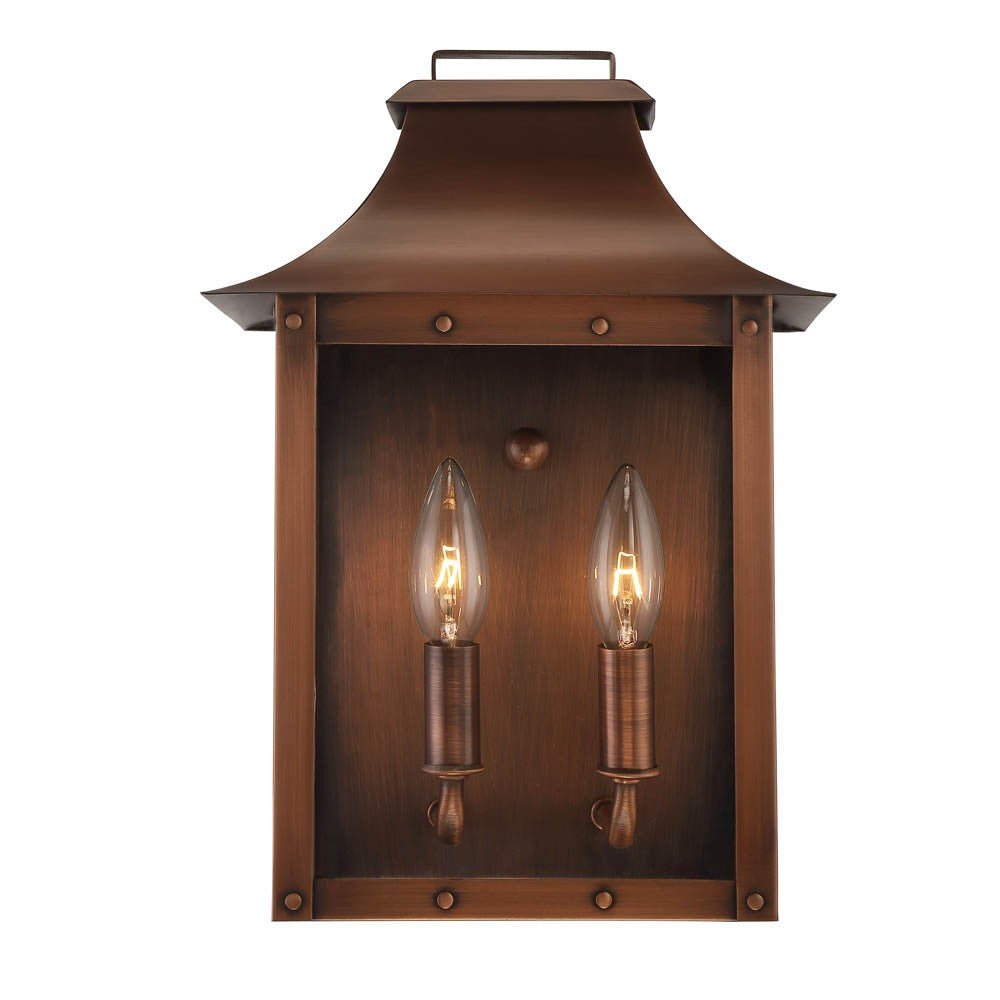Front view of the lighted Manchester 2-Bulb Copper Patina Pocket Wall Lantern with Clear Glass – Rustic Outdoor Lighting Fixture