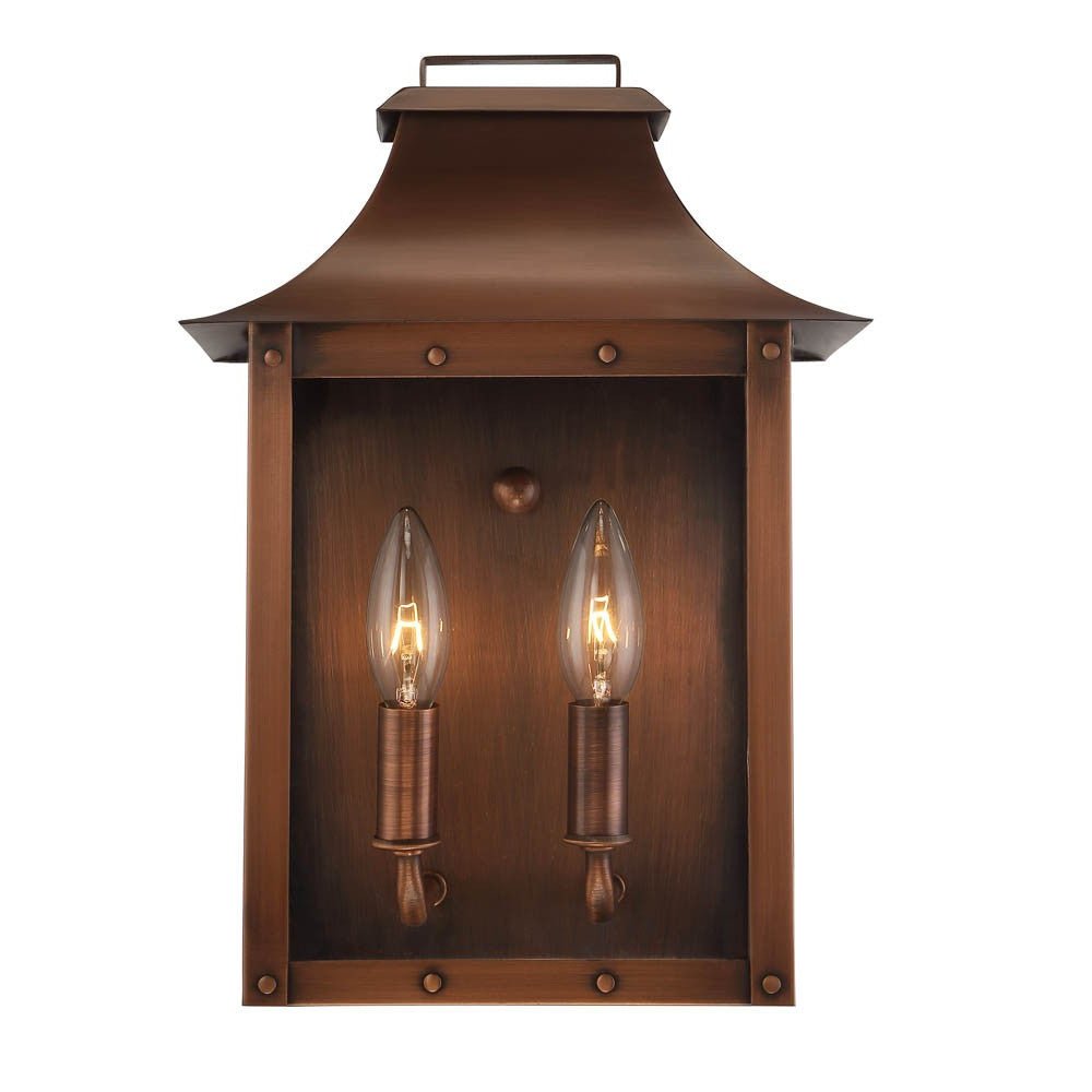 Zoomed in front view of the lighted Manchester 2-Bulb Copper Patina Pocket Wall Lantern with Clear Glass – Rustic Outdoor Lighting Fixture
