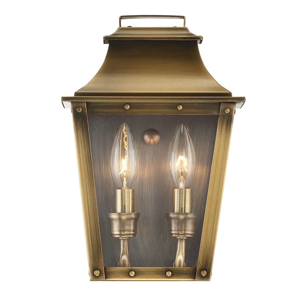 Front view of the lighted Coventry 2-Bulb Aged Brass Pocket Wall Lantern with Clear Glass – Indoor Outdoor Lighting Fixture