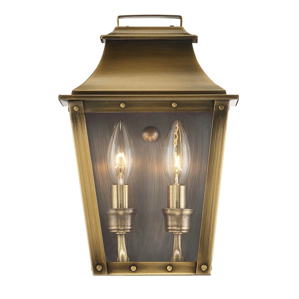 Zoomed in front view of the lighted Coventry 2-Bulb Aged Brass Pocket Wall Lantern with Clear Glass – Indoor Outdoor Lighting Fixture