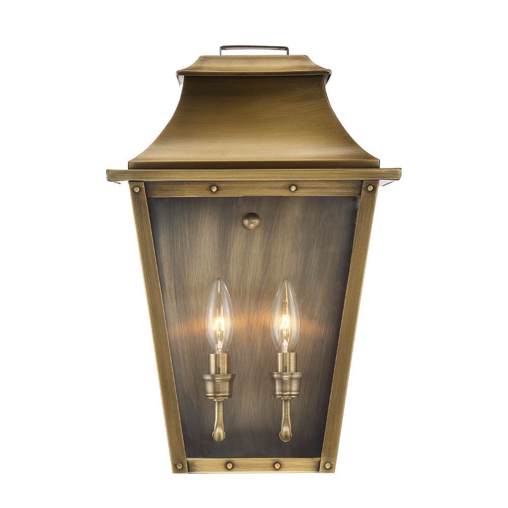 Front view of the lighted Coventry 2-Bulb Aged Brass Pocket Wall Lantern with Clear Glass Panels – Outdoor Indoor Lighting Fixture