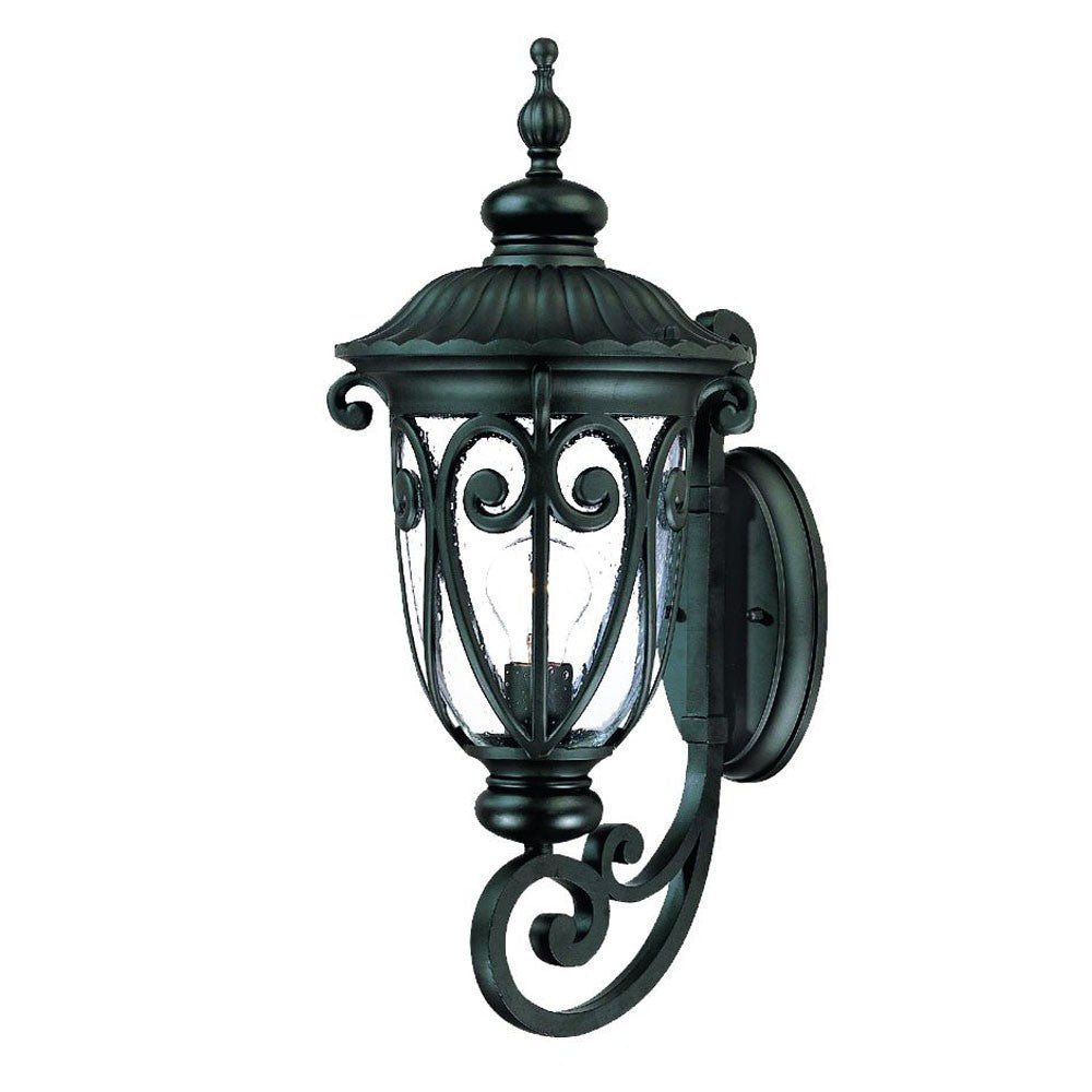 Right side angled view of the Naples Matte Black Outdoor Wall Lantern with Seeded Glass and Scroll Design