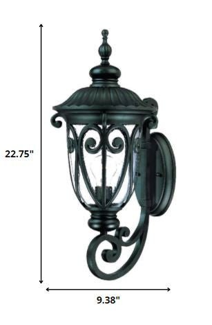 Naples Matte Black Outdoor Wall Lantern with Seeded Glass and Scroll Design shown with dimensions of 22 point 75 inches high by 9 point 38 inches wide