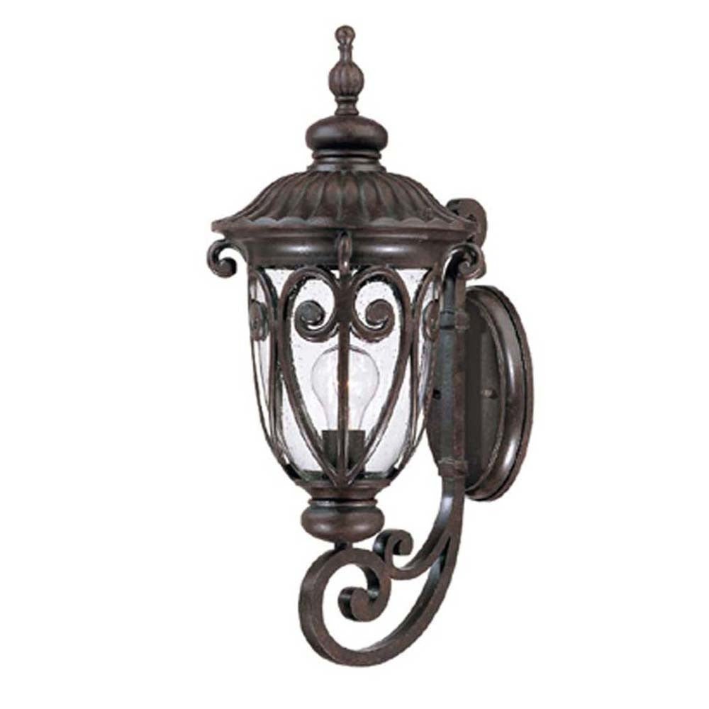 Right side angled view of the marbelized mahogany outdoor wall lantern sconce with ornate cast aluminum frame and clear seeded glass for porch or entryway lighting