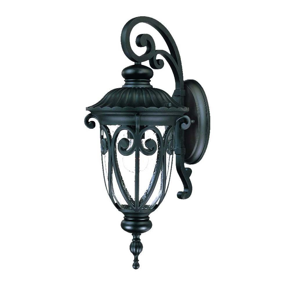Right side angled view of the Naples matte black outdoor wall lantern with ornate scrollwork and seeded glass shade