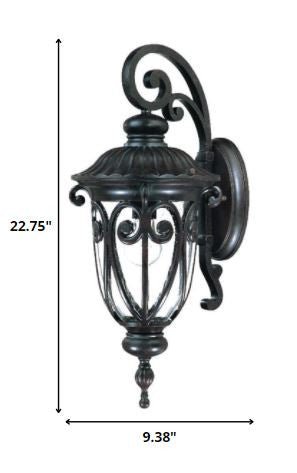 Naples marbleized black outdoor wall light with ornate scrollwork and seeded glass panels shown with dimensions of 22 point 75 inches high by 9 point 38 inches wide