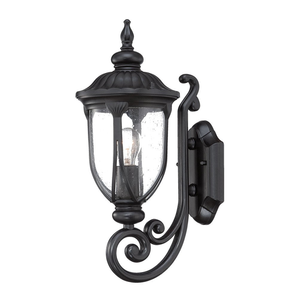 Right side angled view of the lighted Matte black cast aluminum outdoor glass lantern wall light with clear panels