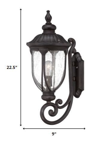 XL black cast aluminum standing lantern outdoor wall light with clear glass panels shown with dimensions of 22 point 5 inches high by 9 inches wide