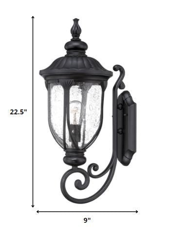 XL matte black cast aluminum standing lantern outdoor wall light with clear glass panels shown with dimensions of 22 point 5 inches high by 9 inches wide