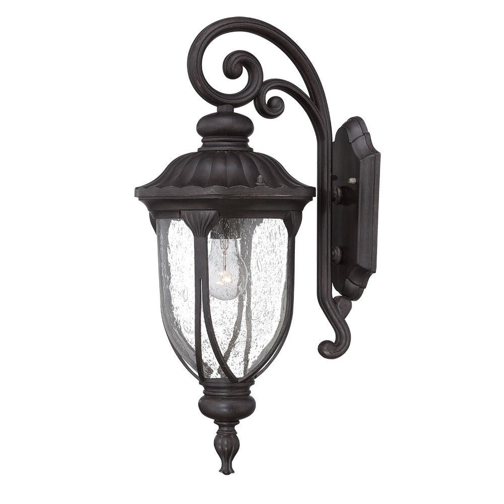 Right side angled view of the lighted XL black cast aluminum outdoor hanging lantern wall sconce with clear glass panels