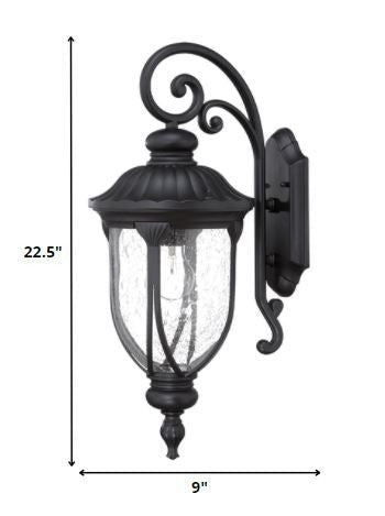 XL matte black cast aluminum outdoor hanging lantern wall sconce with clear glass panels shown with dimensions of 22 point 5 inches high by 9 inches wide
