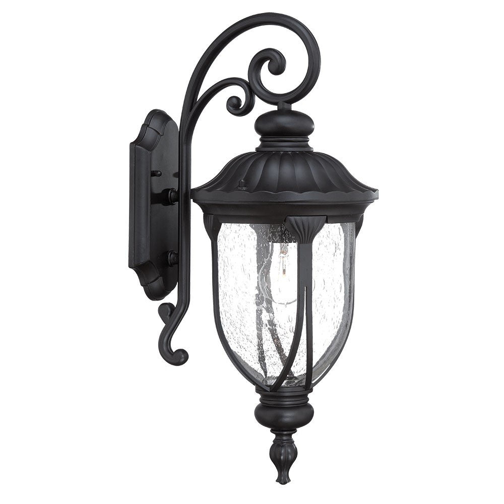 Left side angled view of the XL matte black cast aluminum outdoor hanging lantern wall sconce with clear glass panels