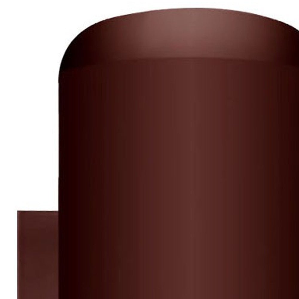 Zoomed in view of the top of the cylinder of the lighted Bronze outdoor cylinder wall sconce with minimalist modern design