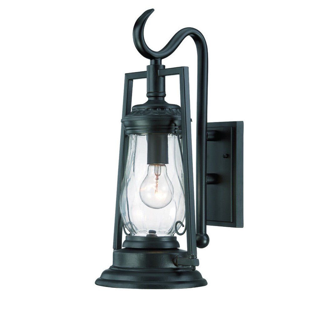 Right side angled view of the lighted Matte black oil lamp-inspired outdoor wall light with clear glass shade