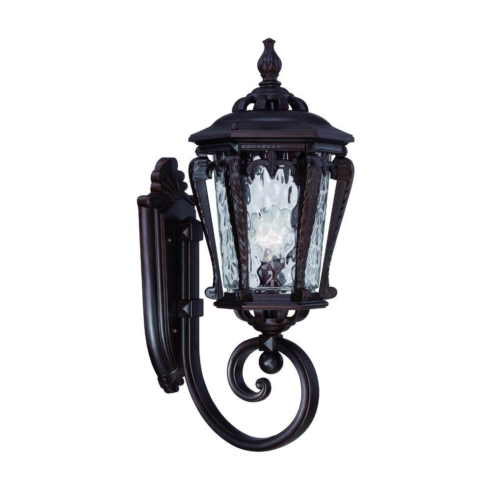 Left side angled view of the Architectural bronze outdoor wall light with hammered glass and scroll detailing